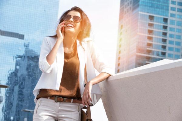 Successful businesswoman talking on phone in Dubai