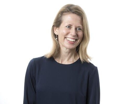 Laura Glendenning looking away from the camera and smiling