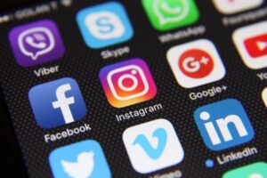 A close up of apps on a phone, including Facebook, Instagram, Skype, LinkedIn, Twitter, Venmo, Whatsapp and Google+.