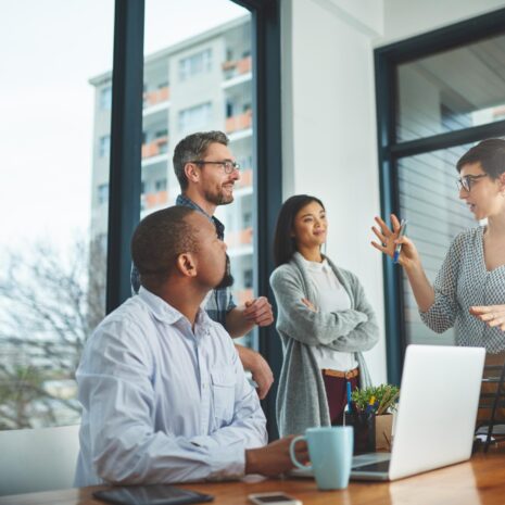 Cropped shot of a group of colleagues having a discussion in a modern office