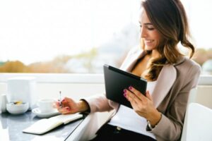 woman working outside, having a coffee