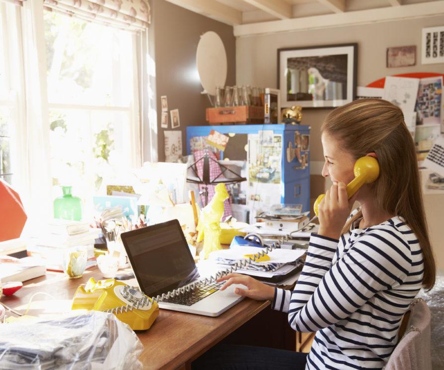 Woman On Laptop Running Business From Home Office
