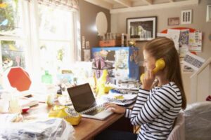 Woman On Laptop Running Business From Home Office