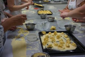 Hands making pasta