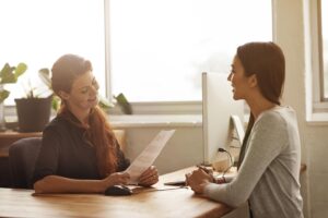 Two women talk about cvs