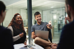 Shot of a group of businesspeople sitting in a circle while having a meeting