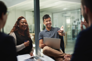 Shot of a group of businesspeople sitting in a circle while having a meeting