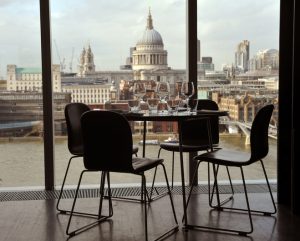 Table and chairs in a restaurant in front of St Pauls