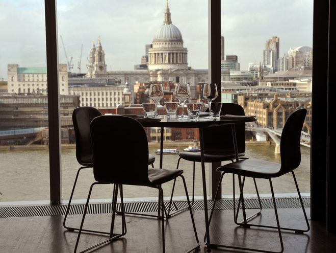 Table and chairs in a restaurant in front of St Pauls