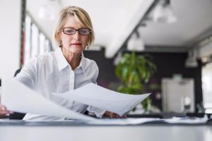 Female office worker handles paperwork
