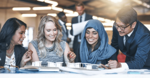 Diverse team in Dubai office laughing