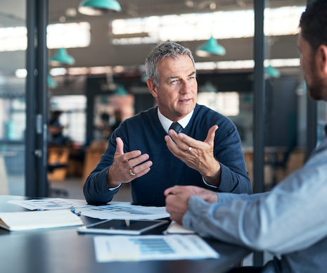 Two men talking in an office