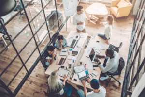 Busy office: a team sits around a table