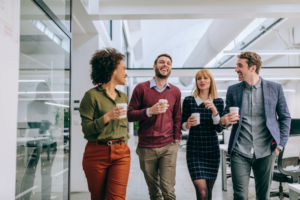 Workers chatting in an office