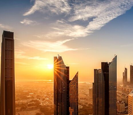 buildings of dubai skyline at sunset