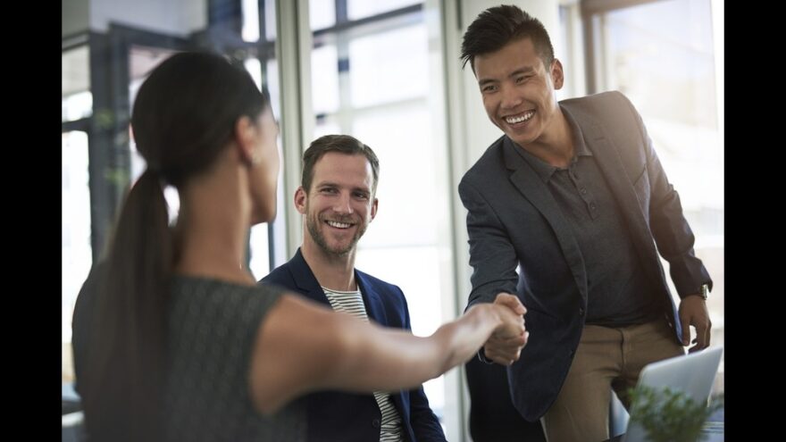 Colleagues greeting each other